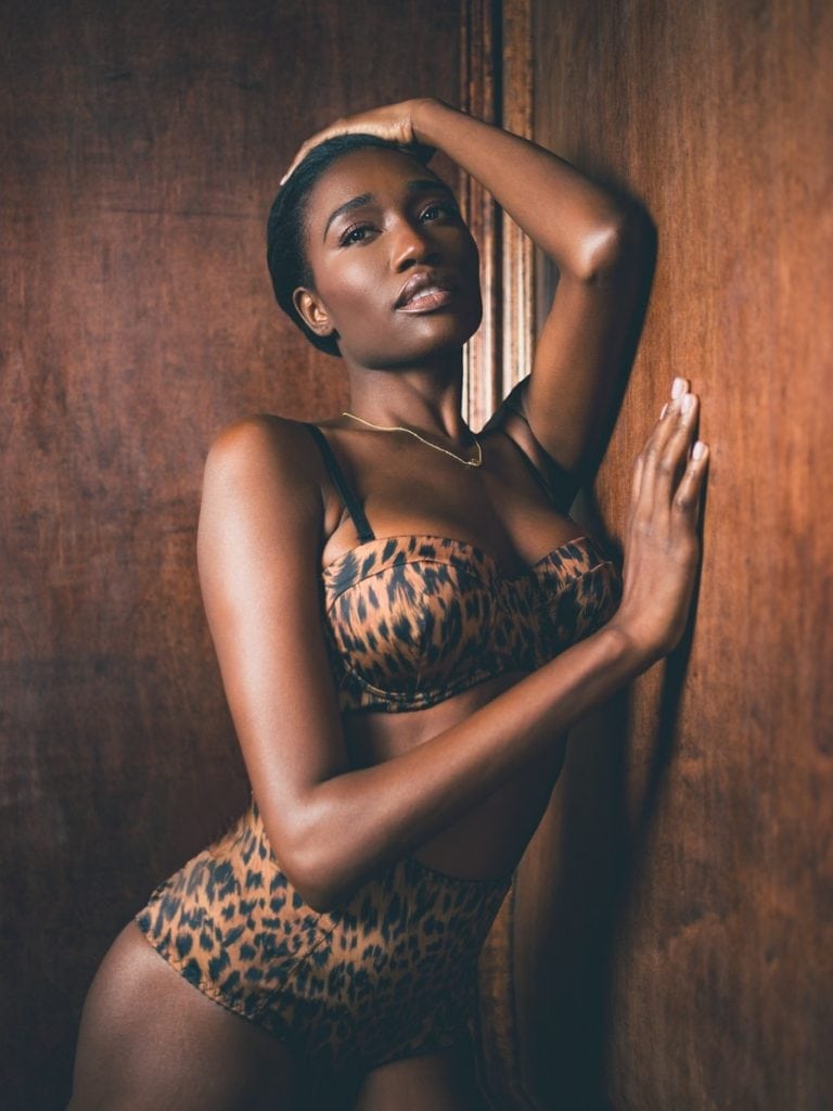 A woman wearing cheetah print lingerie