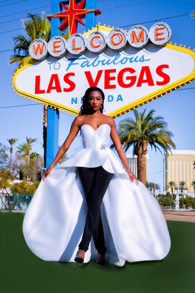 A woman posing in front of the Las Vegas sign